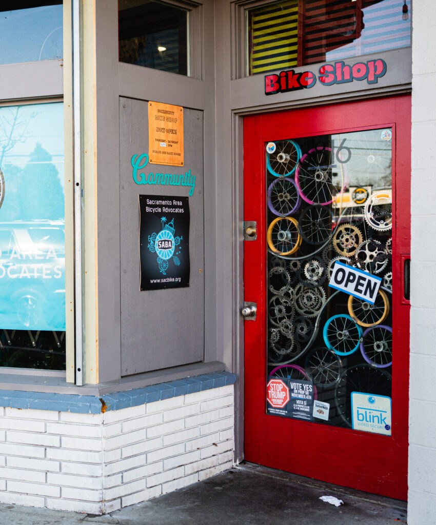 Store front with SABA sign and open sign on door.